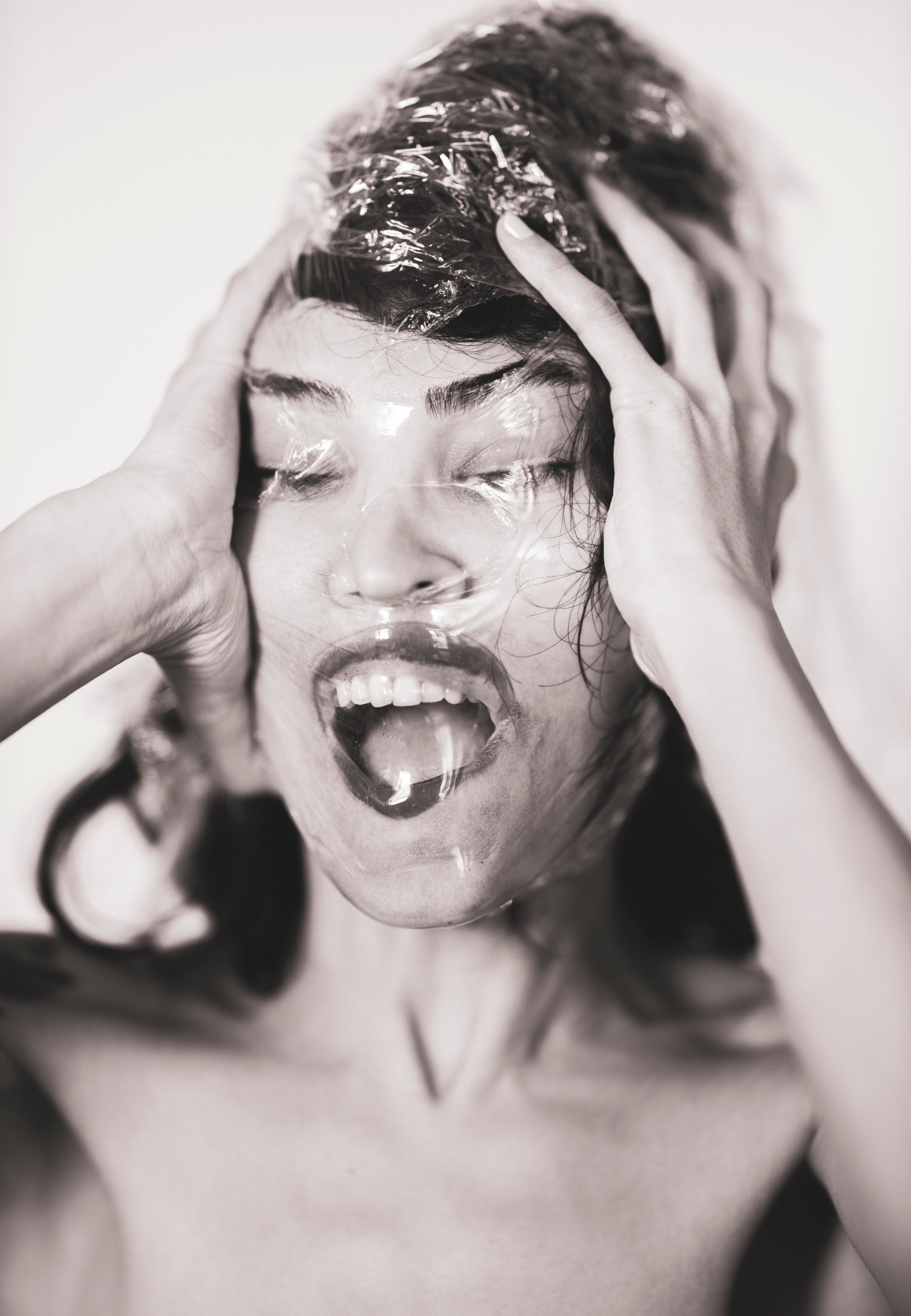 closeupphotoofpersonsfacecoveredwithplasticpack3356443.jpg